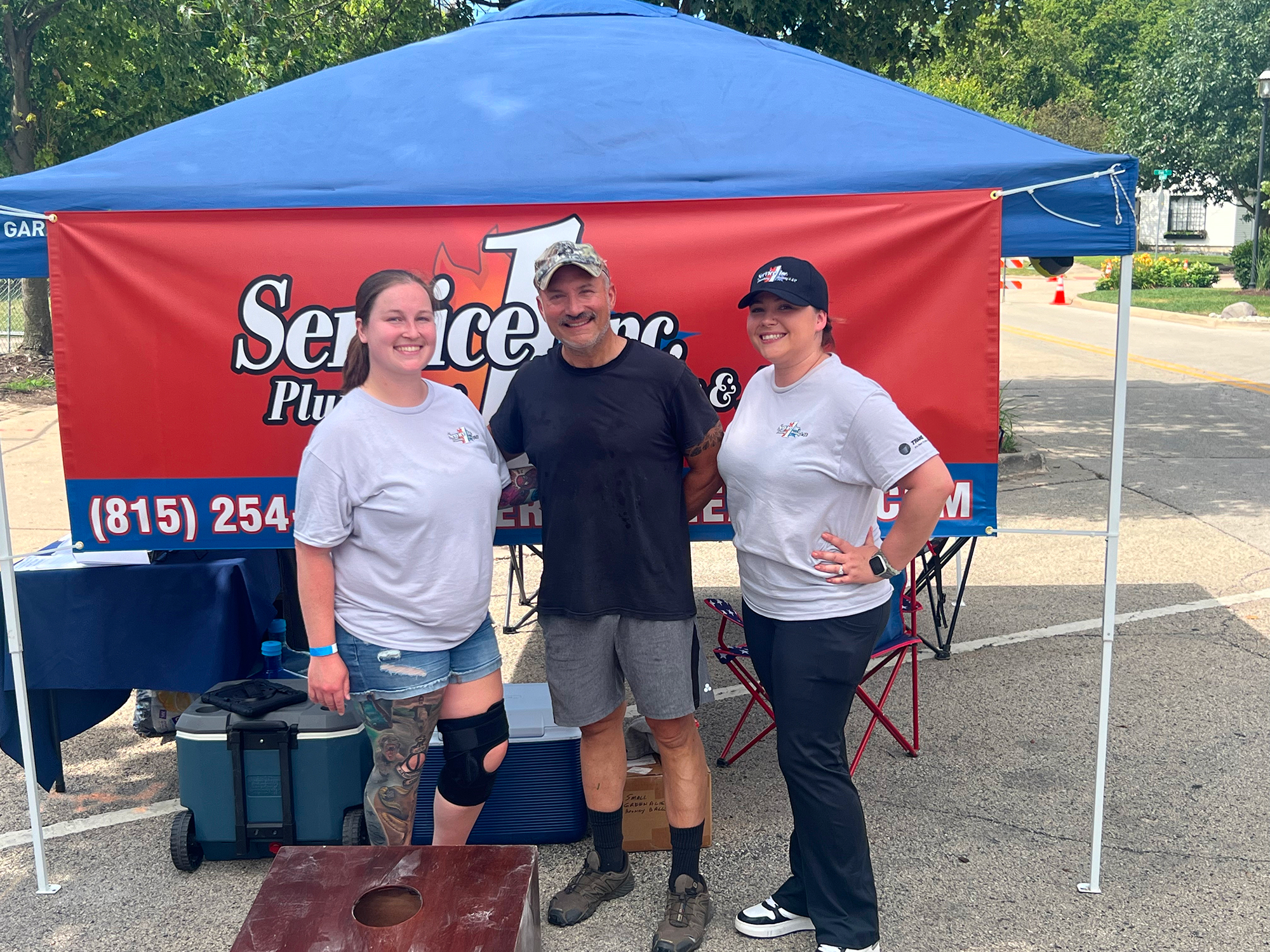 Staff infront of branded tent 2